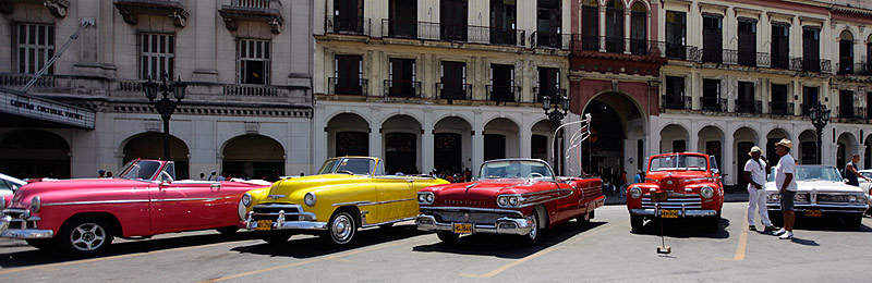 Taxi drivers with US-made vintage convertibles in Havana