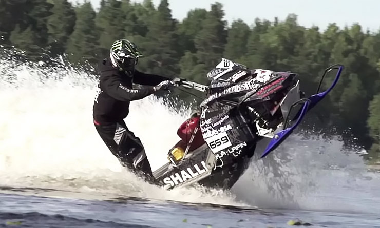 stunt freaks team snowmobile drifting on water