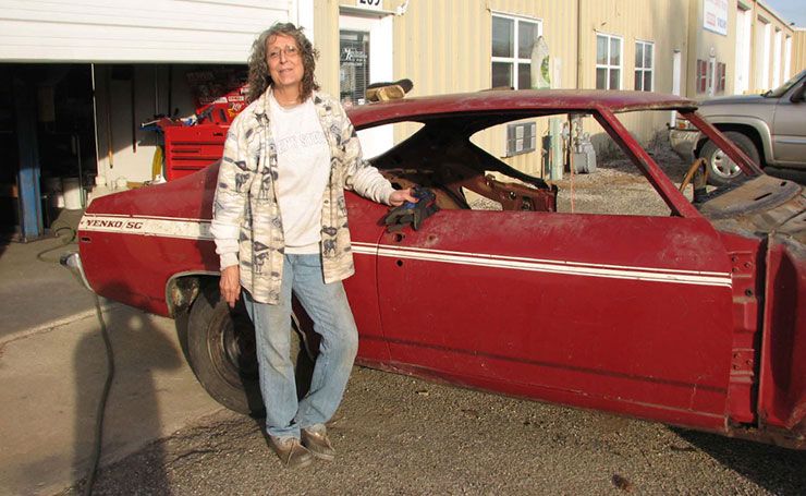 Annie Hartweg stands proud in front of 1969 Yenko SC Chevelle
