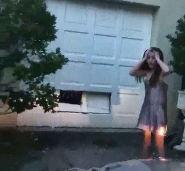 girl drove straight into garage door