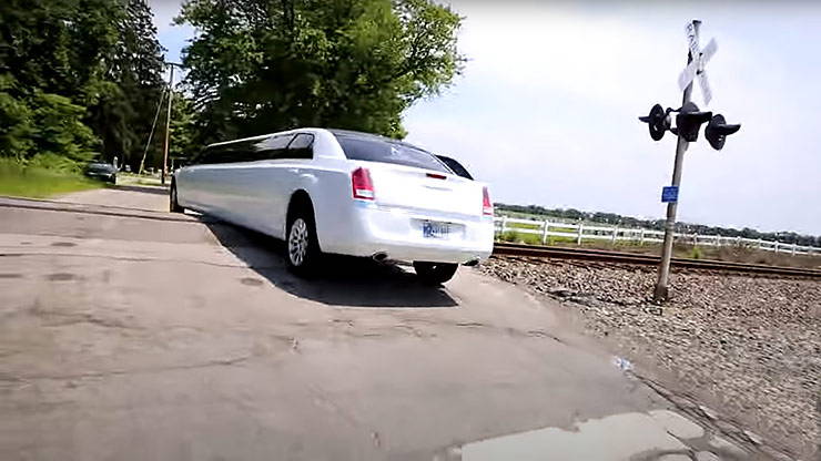 Chrysler limousine stuck on the tracks