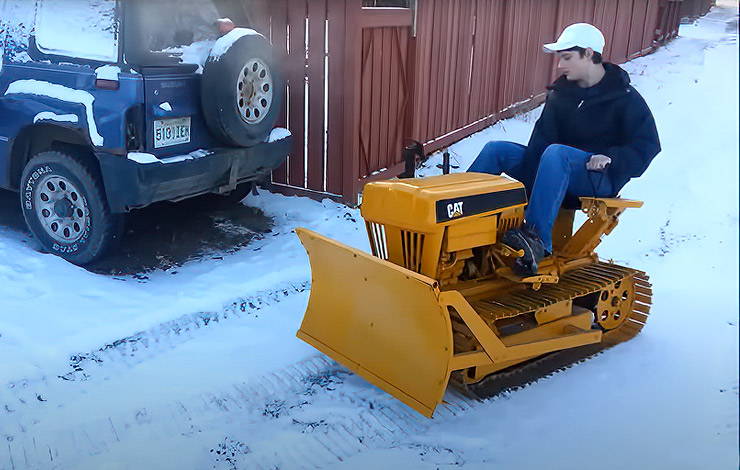 Home made Mini Cat dozer plowing snow